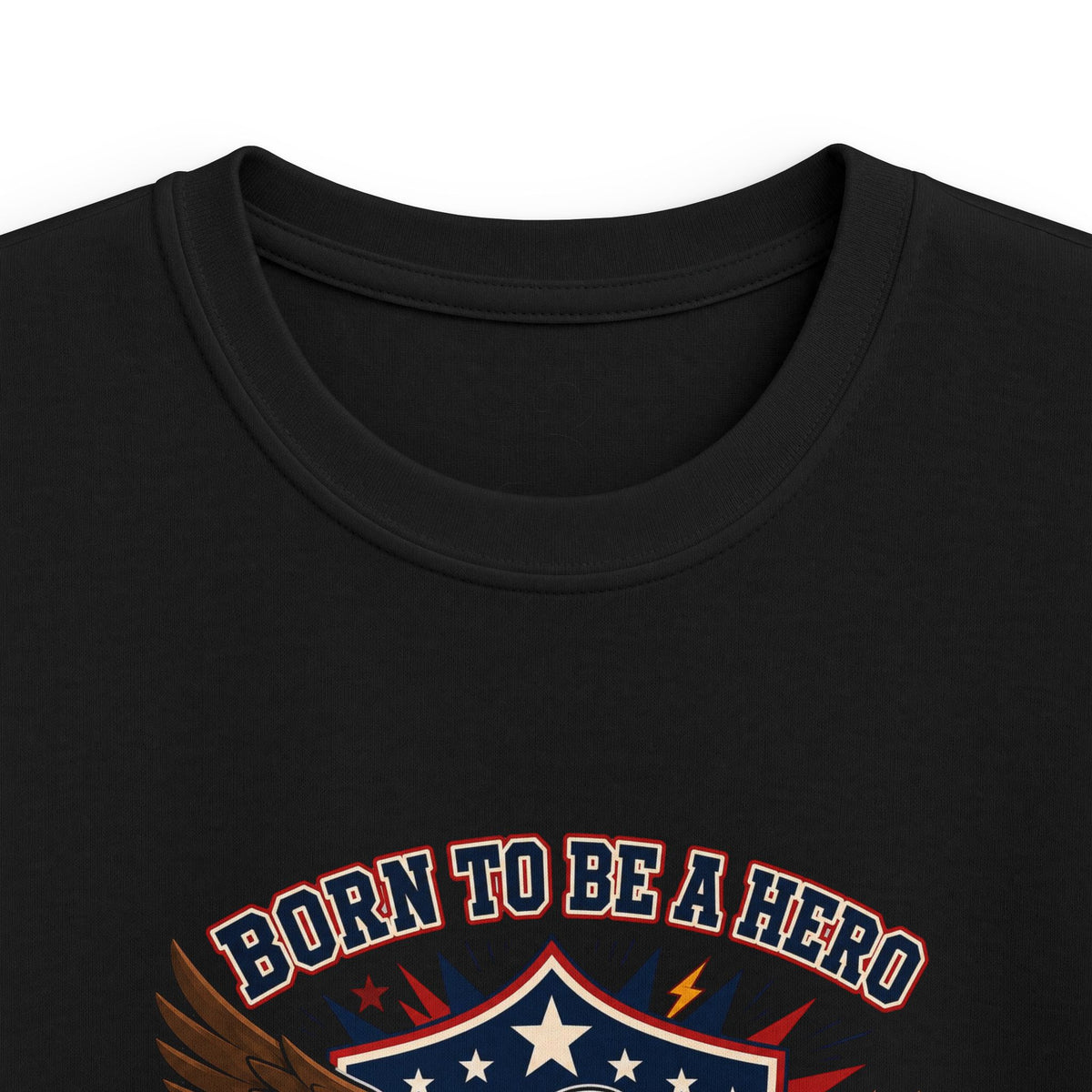 Close-up of black kids T-shirt neckline and “Born to Be a Hero” graphic.