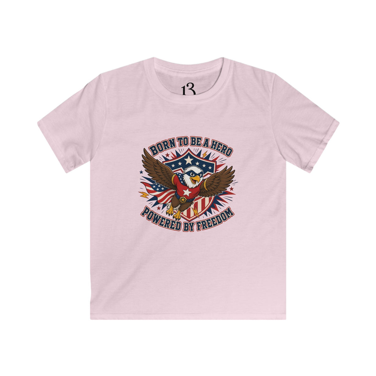 Front view of light pink kids T-shirt with a patriotic superhero eagle and “Born to Be a Hero, Powered by Freedom” lettering.