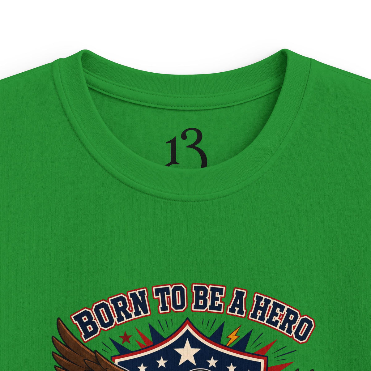 Close-up of Irish green kids T-shirt neckline and “Born to Be a Hero” graphic.