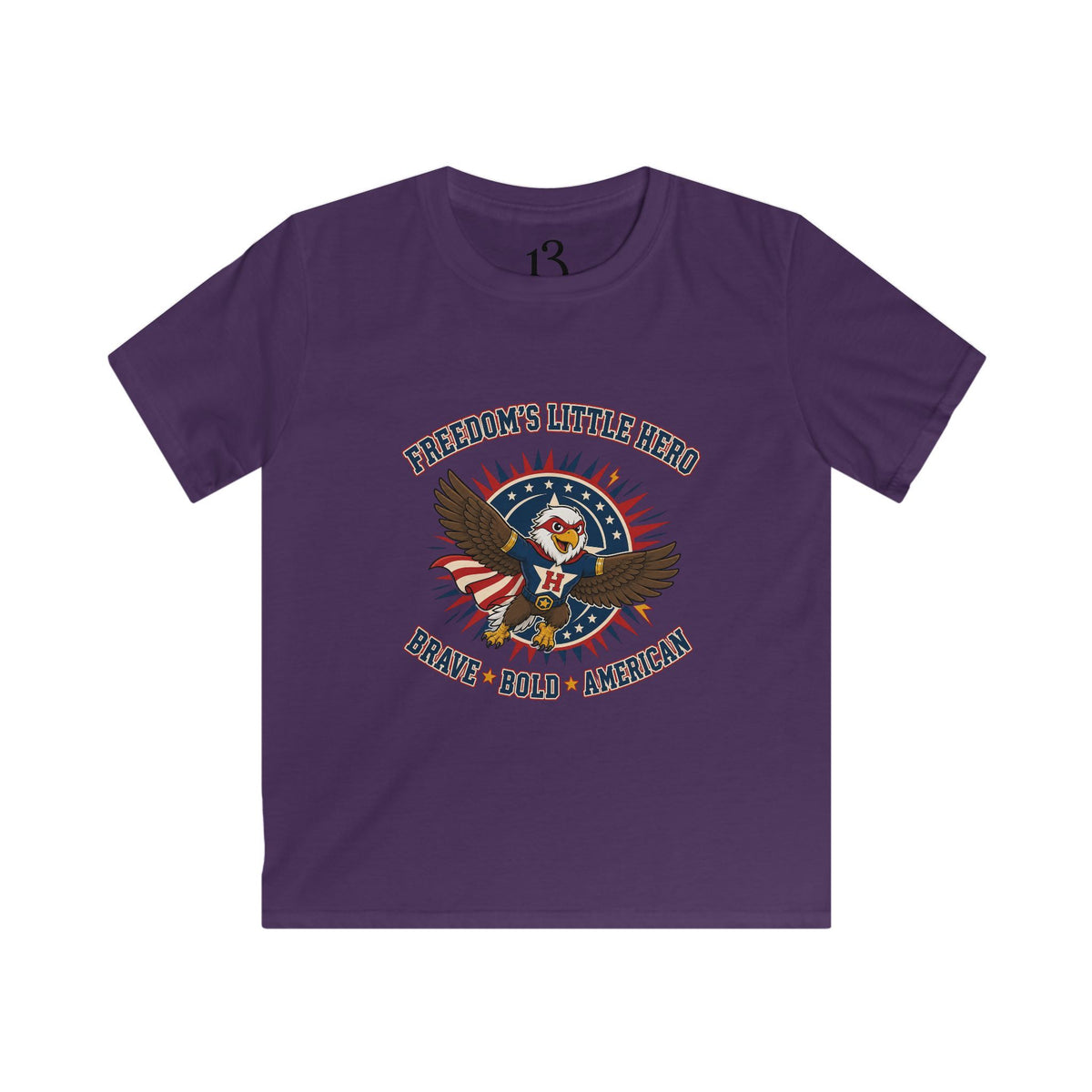 Front view of purple kids T-shirt with a superhero eagle and “Freedom’s Little Hero — Brave, Bold, American” lettering.